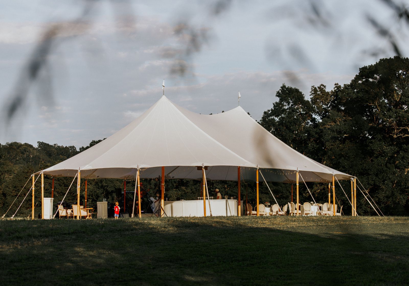 Sailcloth tent set up in the pasture